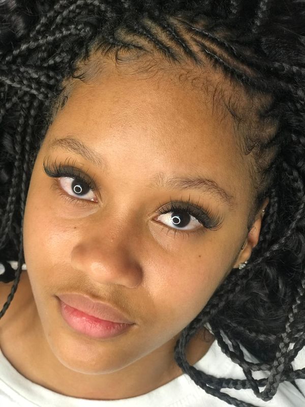 Soft lash set on a client with box braids